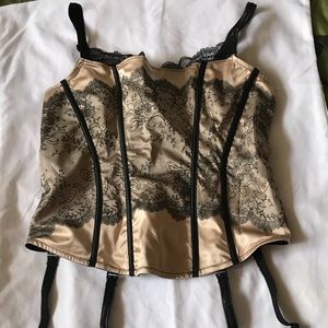 Black lace over champagne colored satin bustier.